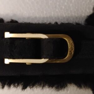 UGG Classic Earmuffs. Black in Color with Gold Tone Hardware.